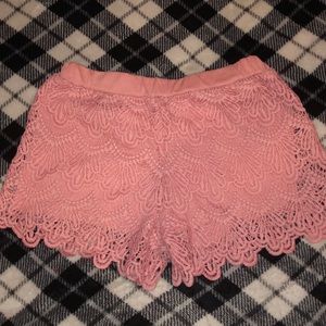 TWO pink and white frilly shorts